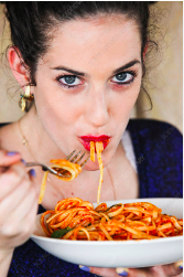 woman eating pasta